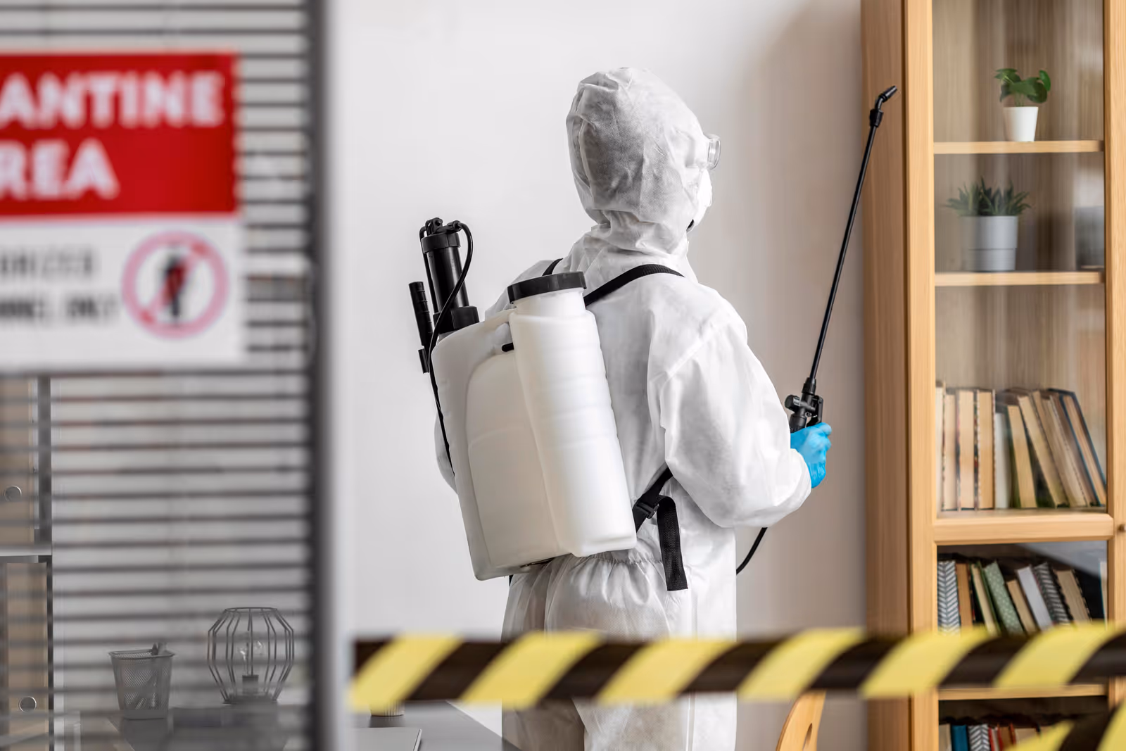 Professional pest control technician performing treatment in Qatar